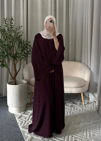 Full-length view of the Layana Embellished Abaya Burgundy with a flowy modest fit