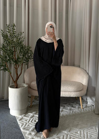 Full-length view of the Layana Embellished Abaya Dark Blue with a flowy modest fit