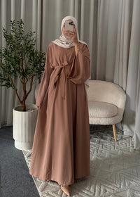 Full-length view of the Layana Embellished Abaya Old Pink with a flowy modest fit