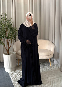 Full-length view of the Nayla Lace Abaya Navy Blue with flowy fit and lace cuffs