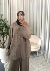 Close-up of the Rima Cable Zip Knit Taupe with cable texture and two-way zip