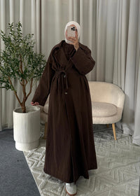 Full-length view of the Zaya Denim Trenchcoat Brown styled as a modest autumn look