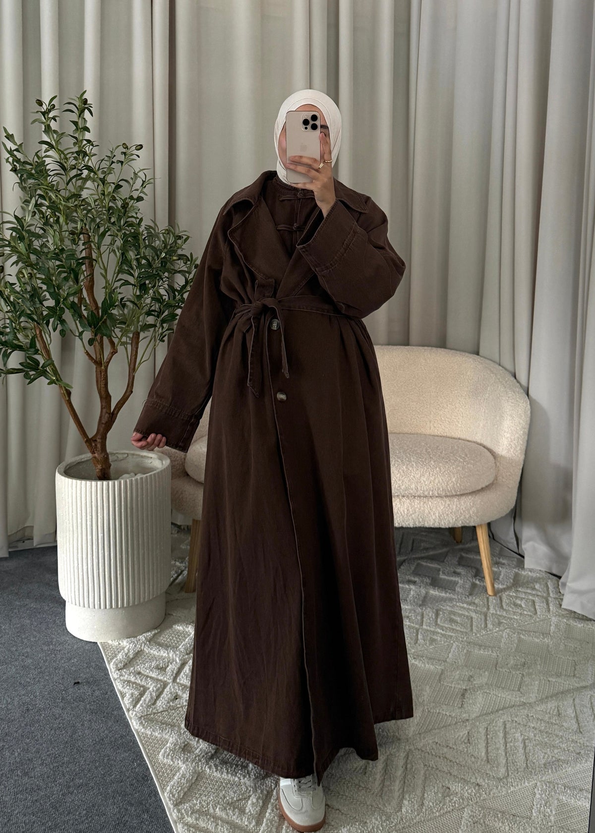 Full-length view of the Zaya Denim Trenchcoat Brown styled as a modest autumn look